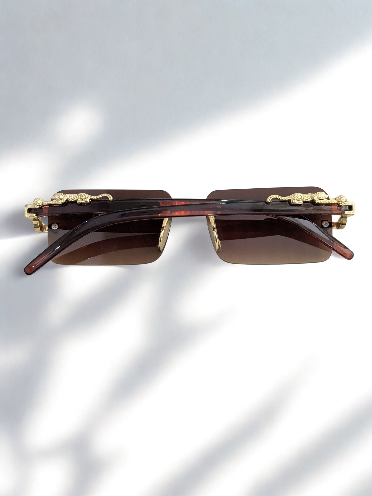 "Luxury Sunglasses with Panther Accent"